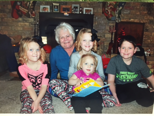 Playing with her grandchildren, Addison, Carley, Peyton and Olivia, and newest arrival, Dallas Landry.